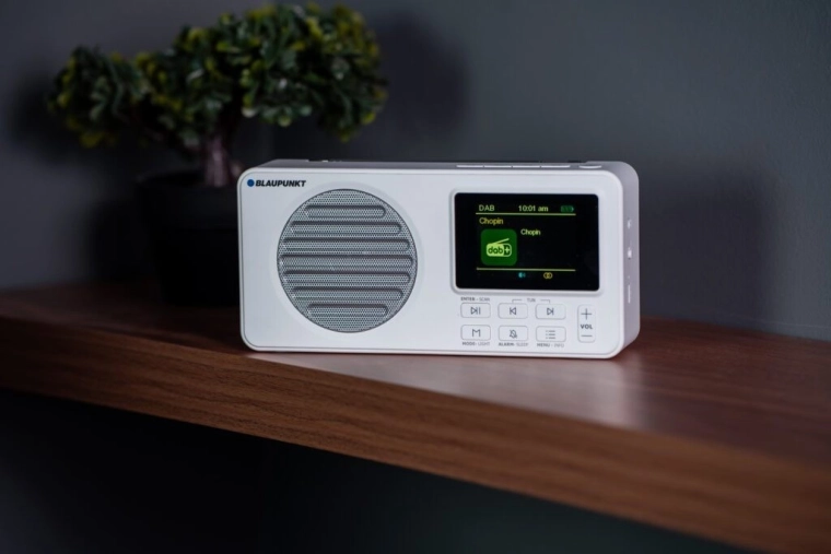 Portable radio with alarm clock