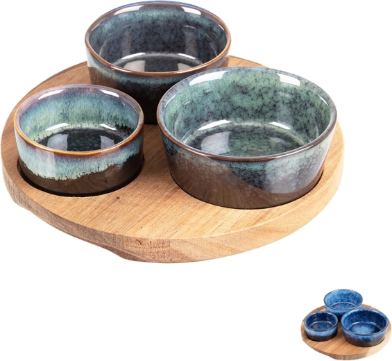 Serving set of ceramic bowls on an acacia wood tray